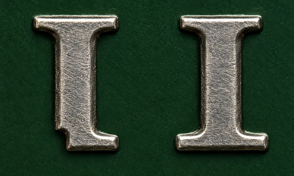 Close comparison of the lower-left serif of the I in LIBERTY