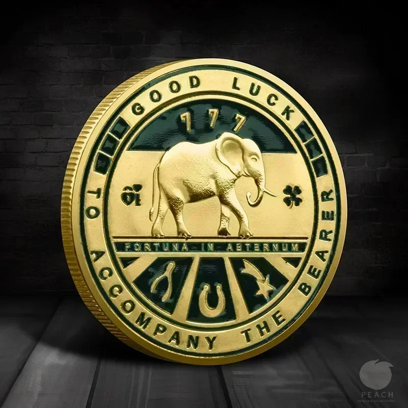 Good-luck elephant and four-leaf clover token — decorative