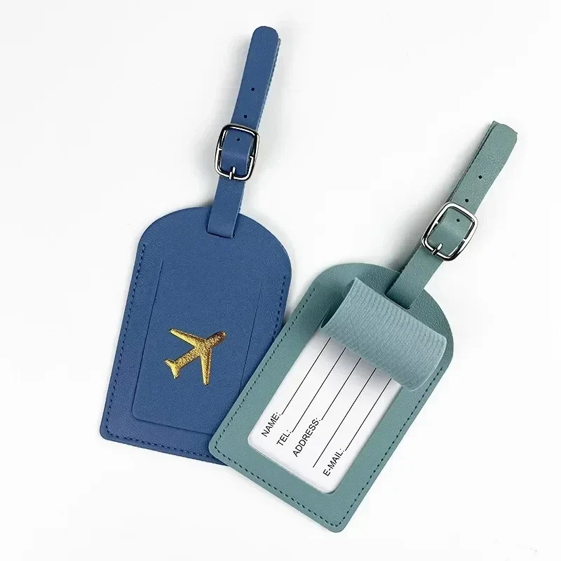 Faux leather luggage tag with privacy flap and buckle strap — representative supplier photograph