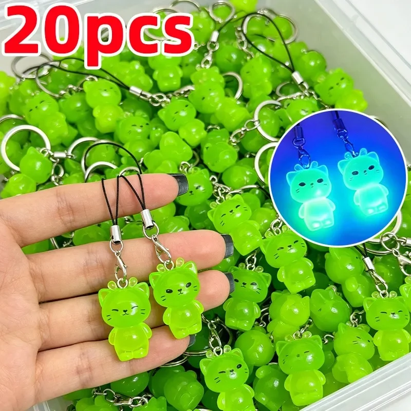 Glow-in-the-dark alien cat charm for phones and bags — representative supplier photograph