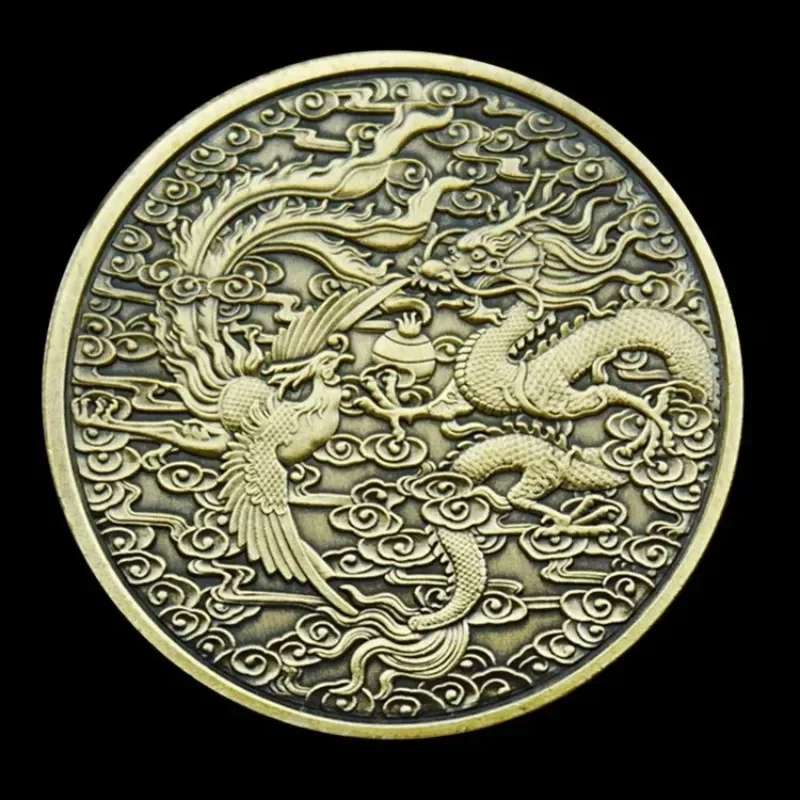 Dragon and phoenix token — decorative bronze-tone coin