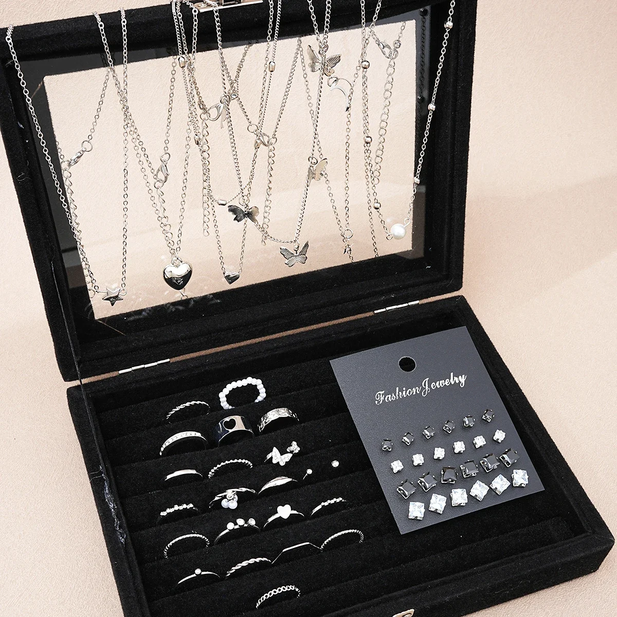 51-piece fashion jewelry set: necklaces, rings and stud earrings — representative supplier photograph