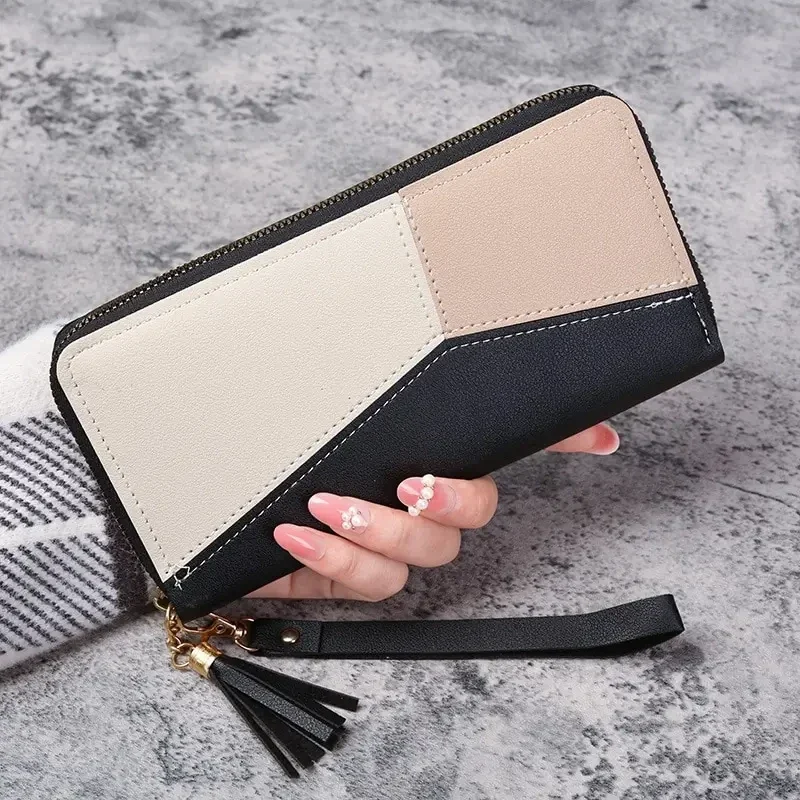 Long zip-around wallet with wrist strap, colour-block faux leather — representative supplier photograph