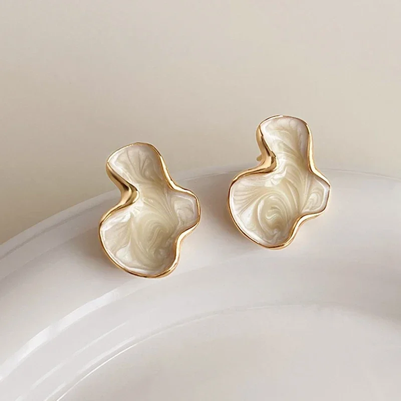 Abstract cloud stud earrings with marbled finish — representative supplier photograph
