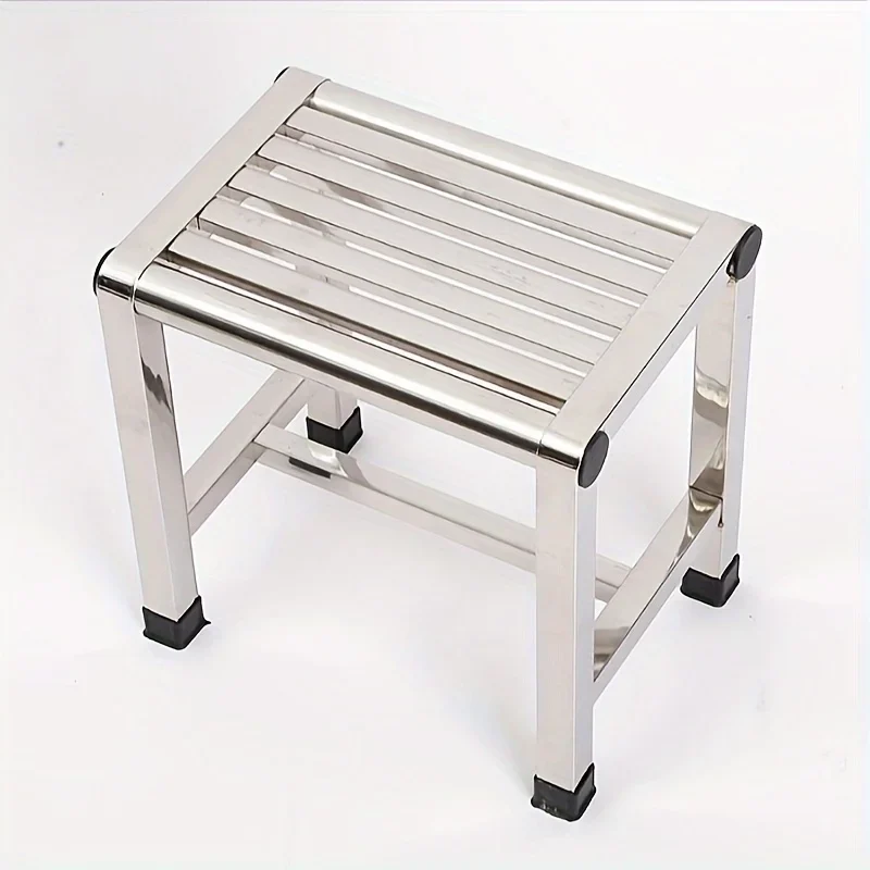 Low stainless steel step stool with slatted top — representative supplier photograph