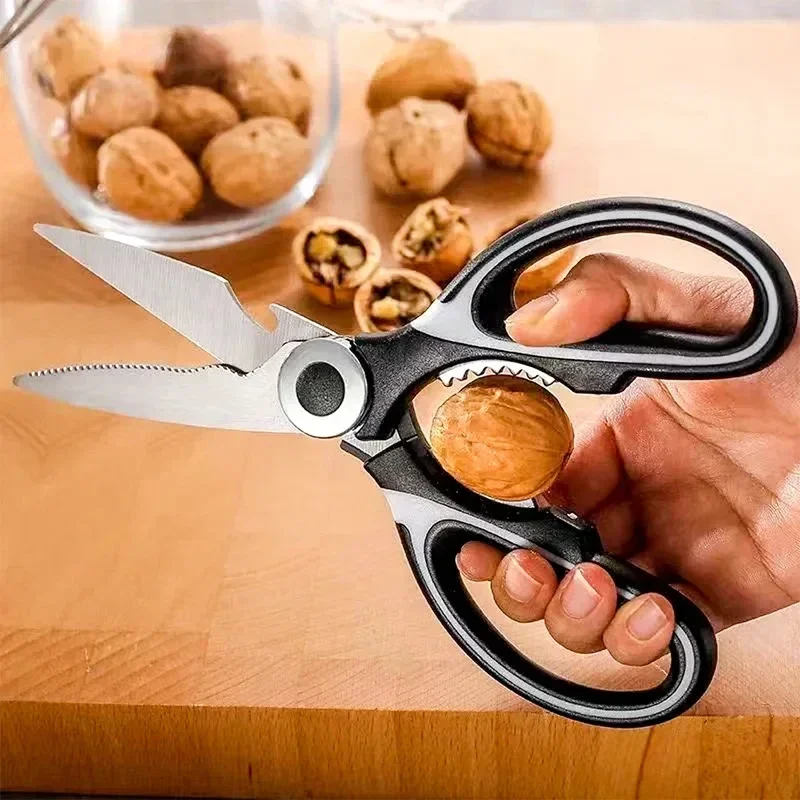 Heavy-duty kitchen shears with nutcracker and bottle opener, with blade cover — representative supplier photograph
