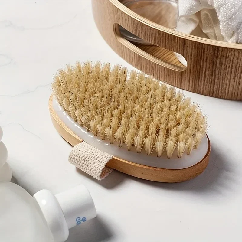 Oval bristle body brush with hand strap — representative supplier photograph