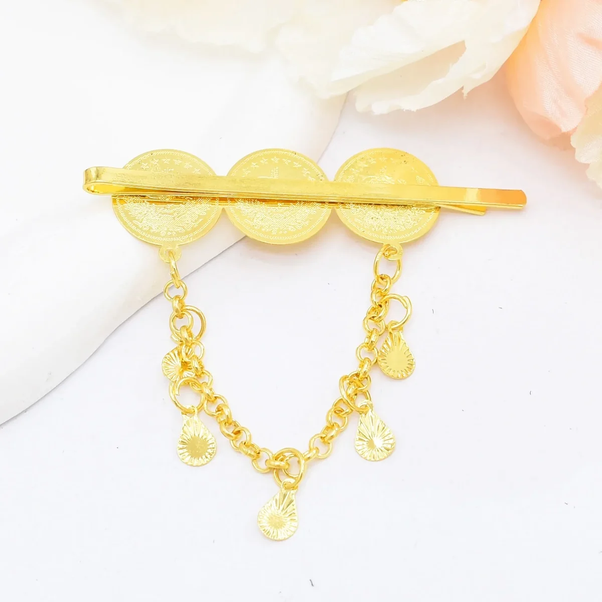 Coin and chain tassel hair clip, bohemian style, aged brass tone — representative supplier photograph