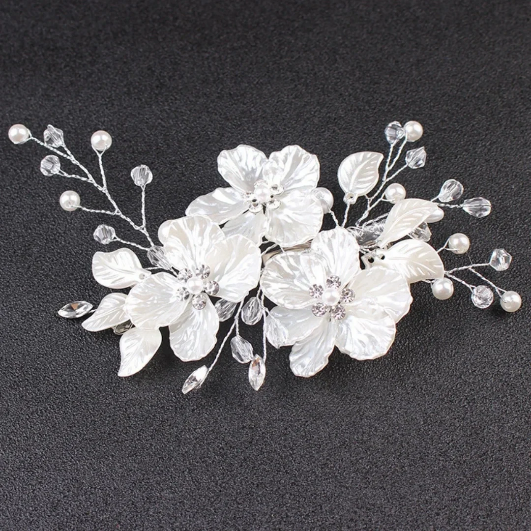Bridal side hair clip with white flowers, faux pearls and crystal sprays — representative supplier photograph
