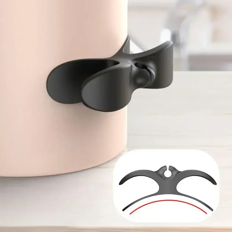 Stick-on cord winders for small appliances, black — representative supplier photograph