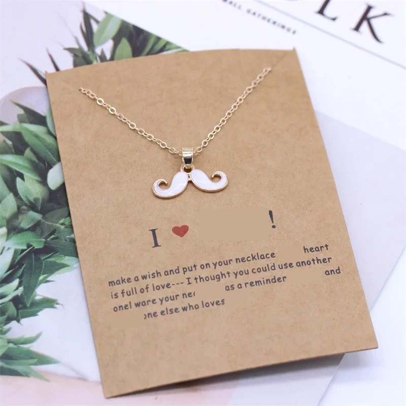 Moustache pendant necklace on an "I love you" gift card — representative supplier photograph