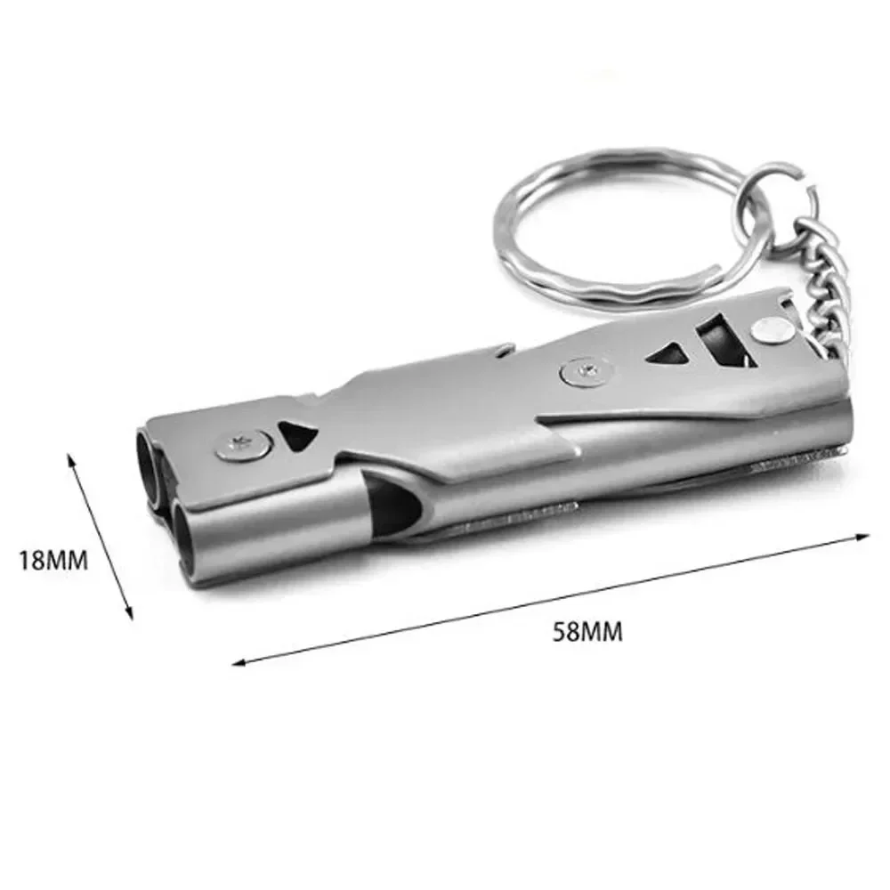 Twin-tube emergency whistle with key ring — representative supplier photograph