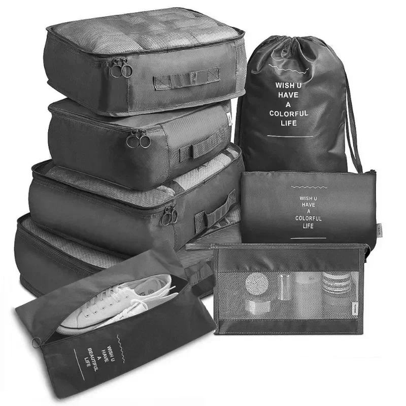 Travel packing organizer set, 7 pieces: packing cubes, pouches and shoe bag, black — representative supplier photograph