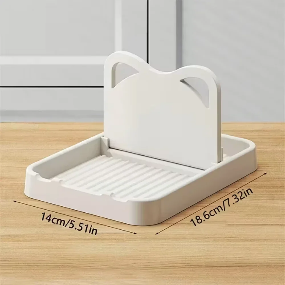 Silicone pot lid and spoon rest for the stovetop, 19 x 14 cm — representative supplier photograph