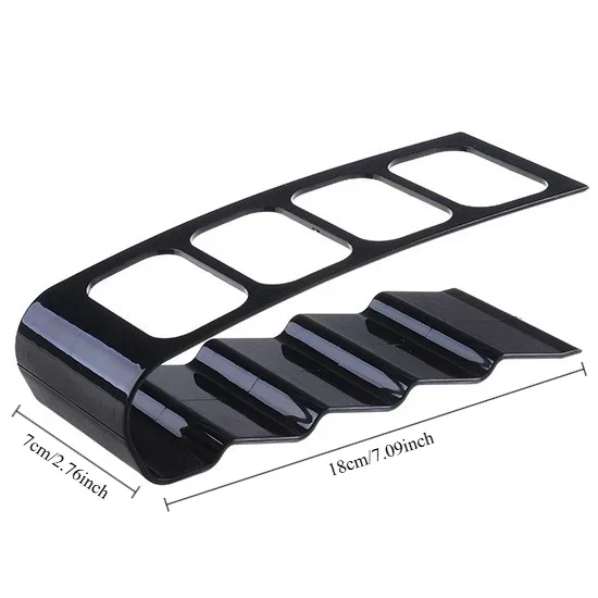 Remote control holder, 4 slots, black — representative supplier photograph