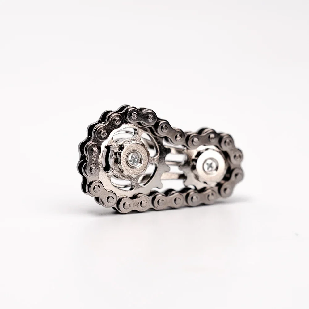 Bike chain gear fidget spinner, metal, black — representative supplier photograph