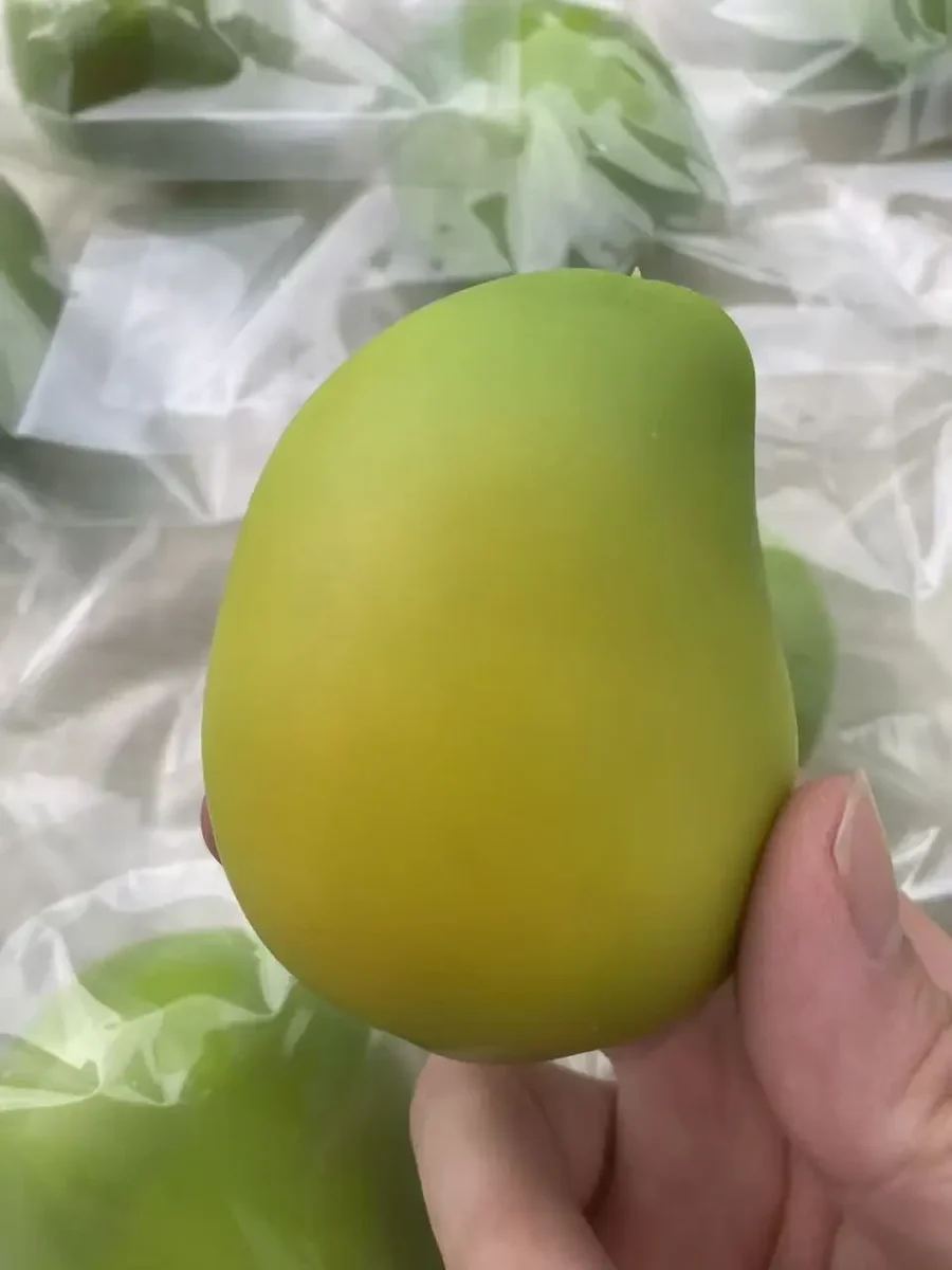 Squishy green mango squeeze toy, 1 or 2 — representative supplier photograph