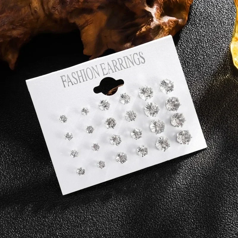 Clear stone stud earrings in graduated sizes, card of 12 pairs — representative supplier photograph