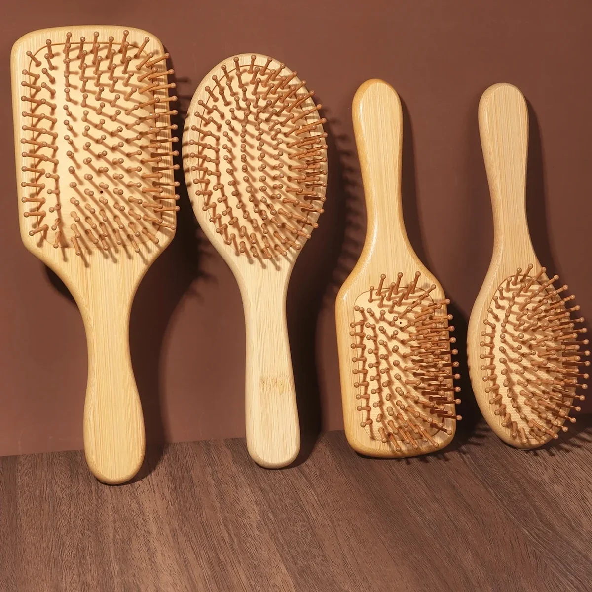 Bamboo paddle hair brush with cushioned bamboo pins, medium or large — representative supplier photograph