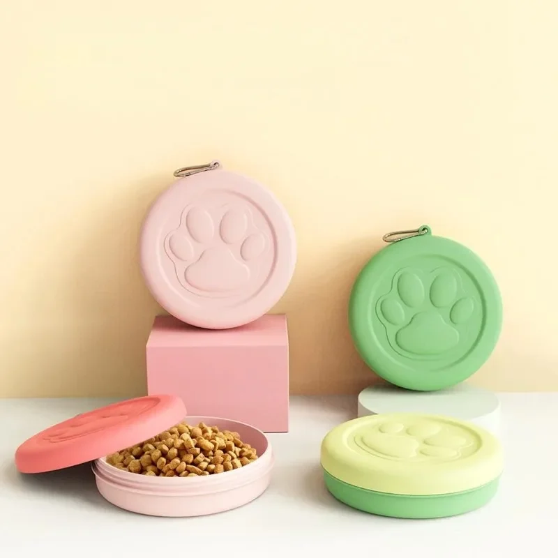Clip-on travel pet bowl with lid, paw-print design
