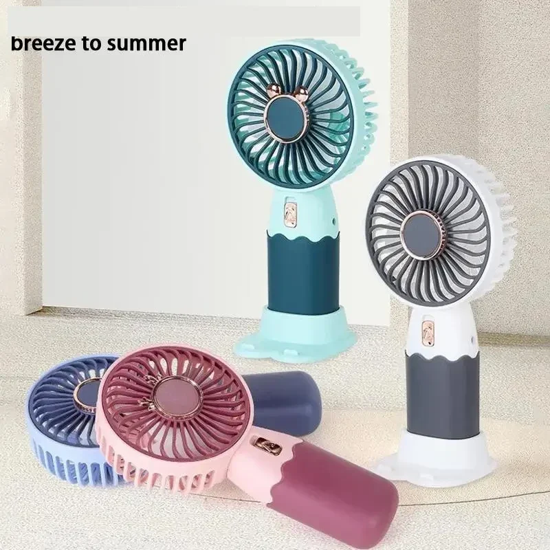 Rechargeable handheld mini fan with phone stand, grey — representative supplier photograph