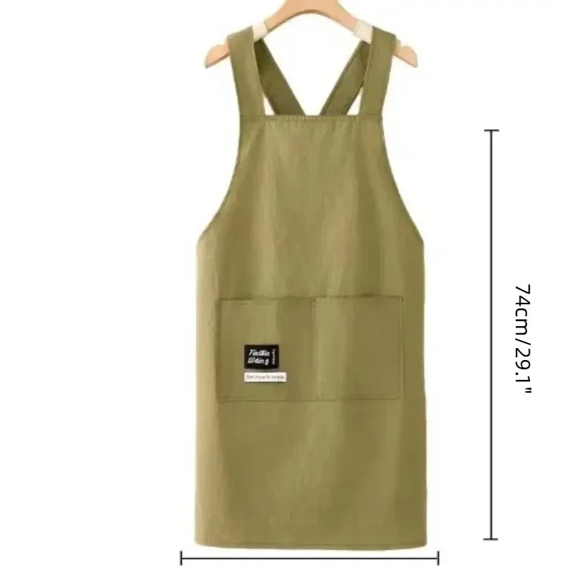 Cross-back work apron with front pocket, water-resistant, khaki green — representative supplier photograph