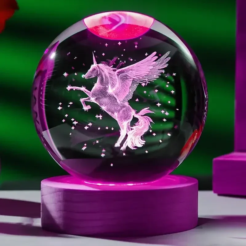 Laser-engraved unicorn crystal ball on a colour-changing LED base — representative supplier photograph