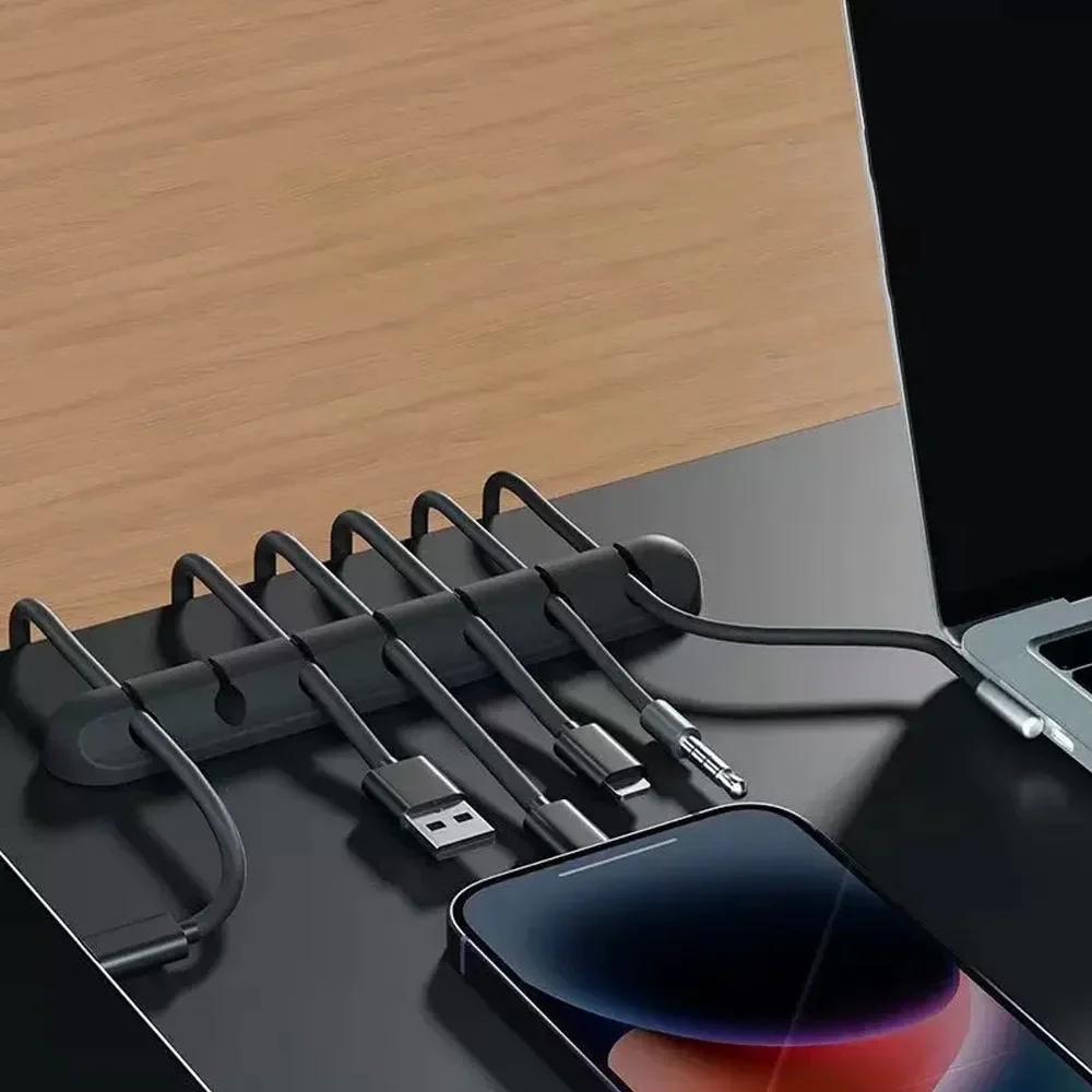 Adhesive desk cable organiser with 3, 5 or 7 slots — representative supplier photograph