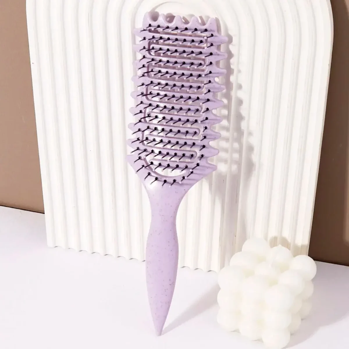 Vented curved styling brush for detangling and blow-drying — representative supplier photograph