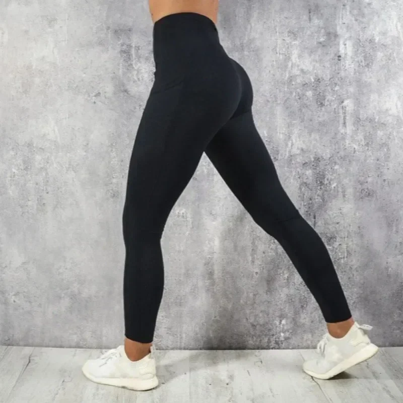 High-waist workout leggings with side phone pocket, black, S to XL — representative supplier photograph