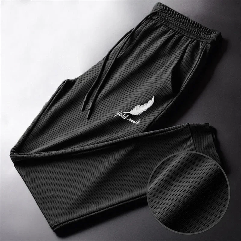 Men's quick-dry mesh jogger pants with drawstring waist and tied ankles — representative supplier photograph
