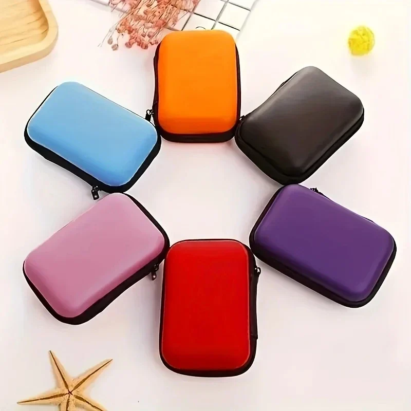 Small hard-shell zip case for cables, earphones and cards — representative supplier photograph